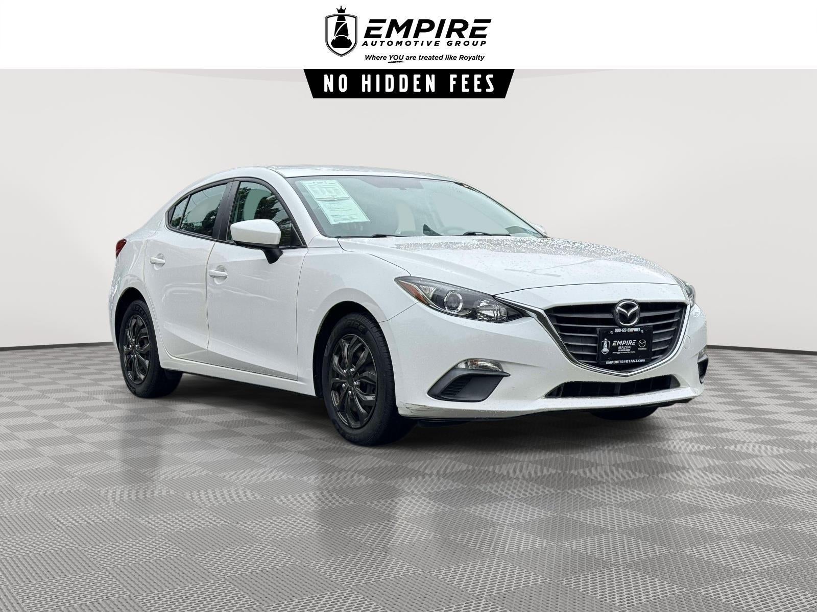 2015 Mazda Mazda3 i Sport in Snowflake White Pearl Mica — front three-quarter view