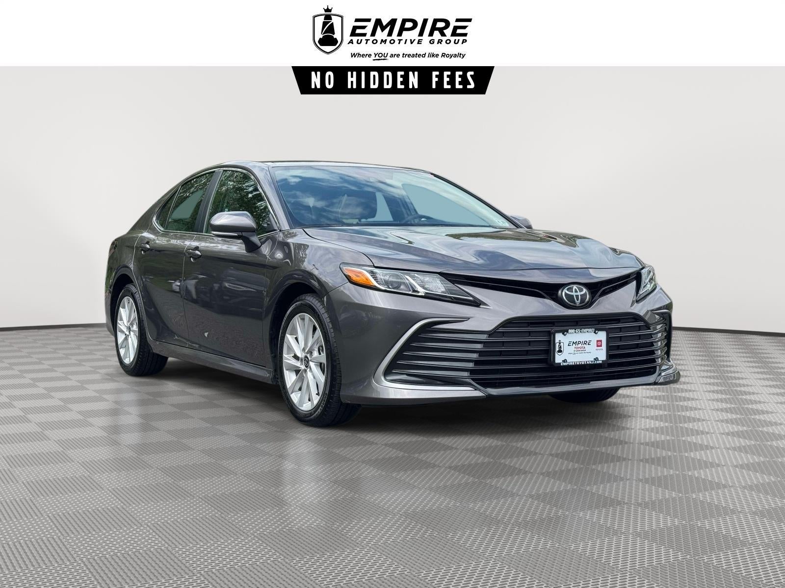 2024 Toyota Camry LE in Predawn Gray Mica — front three-quarter view