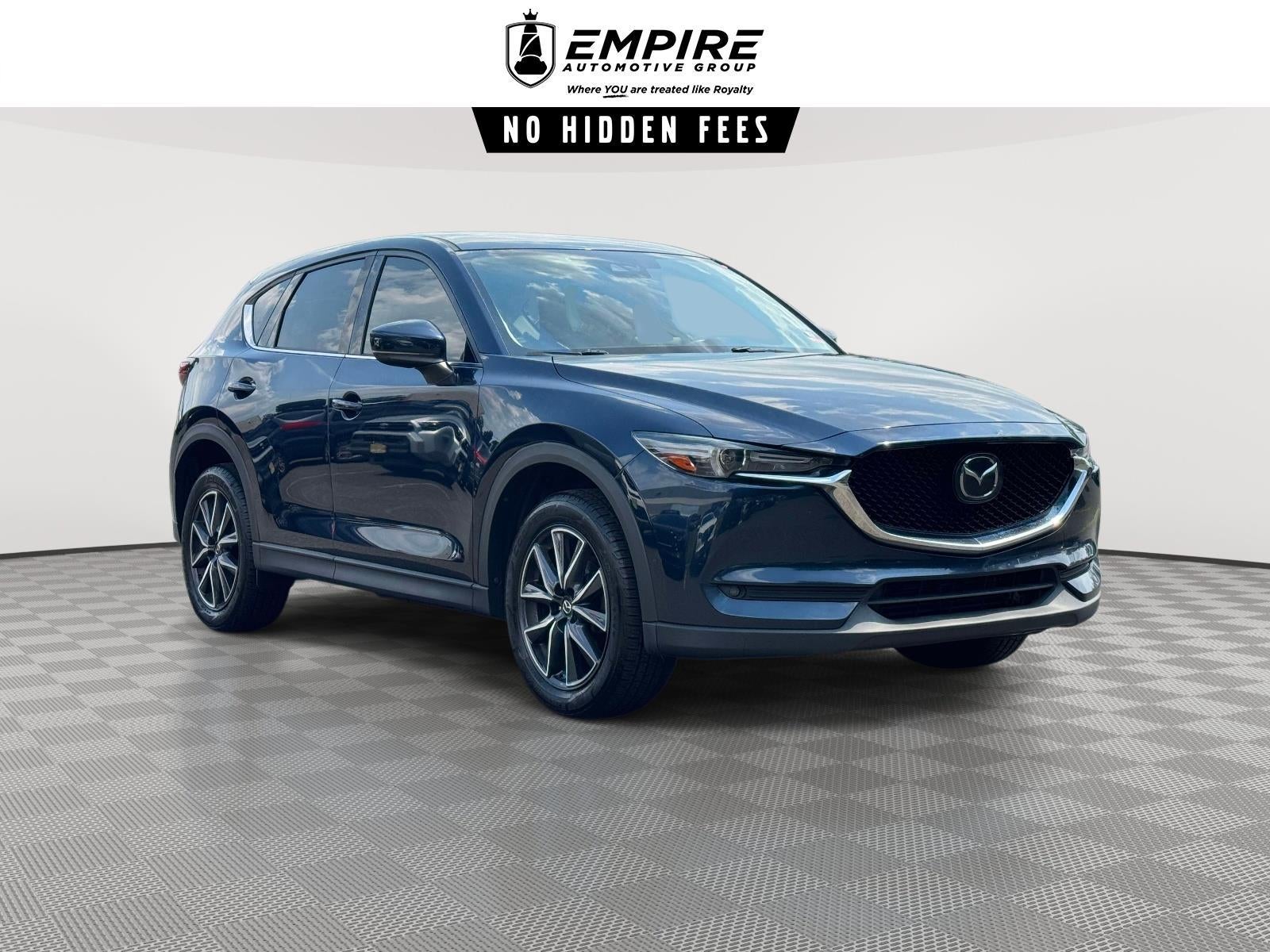2017 Mazda Mazda CX-5 Grand Touring in Deep Crystal Blue Mica — front three-quarter view