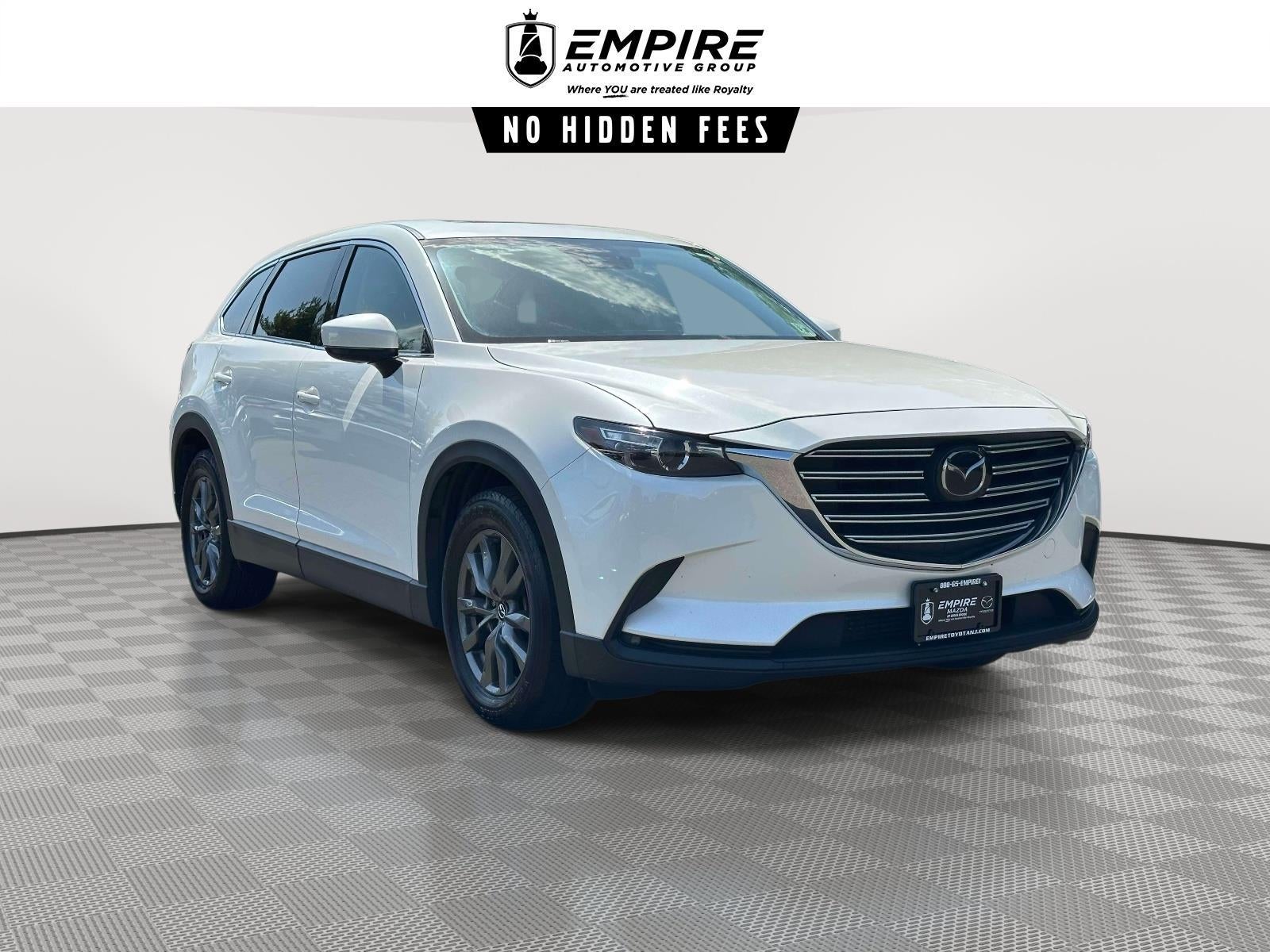 2023 Mazda Mazda CX-9 Touring in Snowflake White Pearl Mica — front three-quarter view